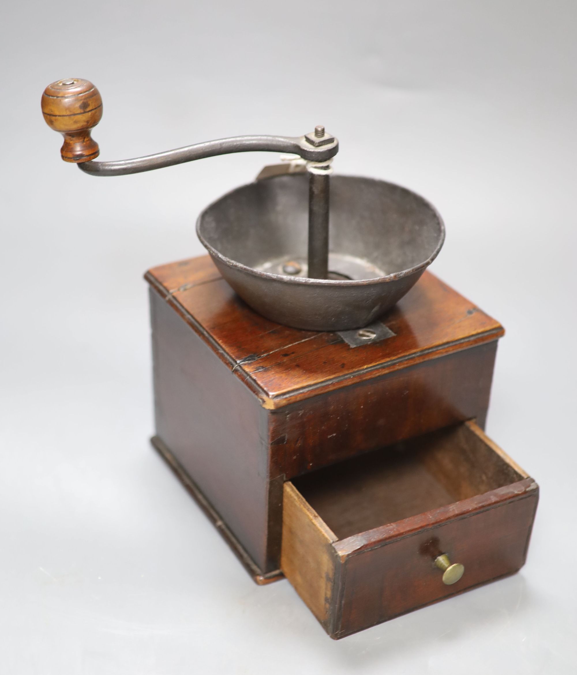 An aneroid barometer together with a 19th century mahogany coffee grinder and an inlaid box